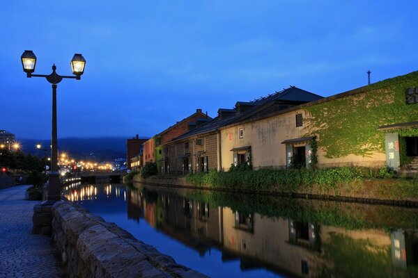 The house is near the water. Beautiful lantern