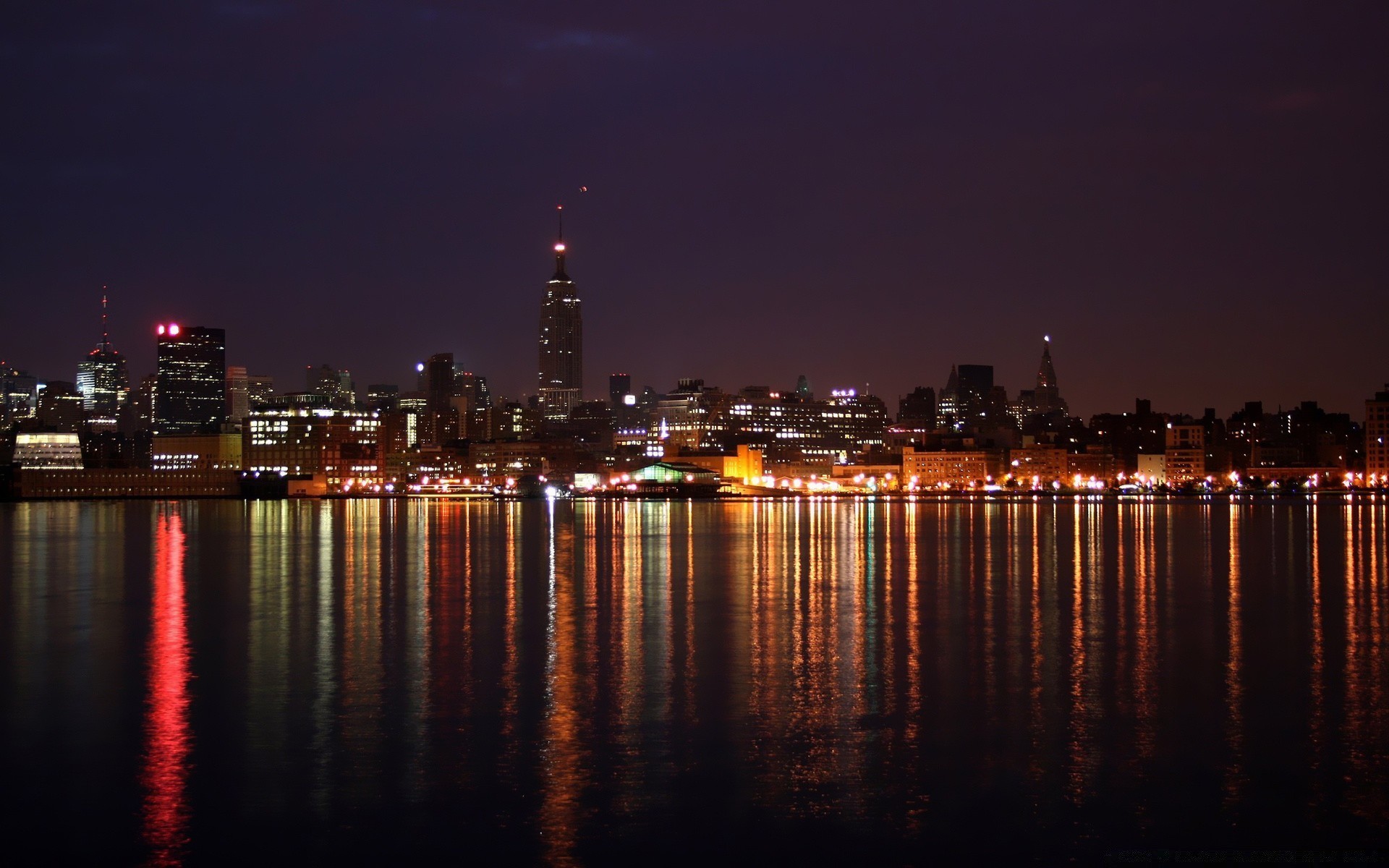 other city city water reflection cityscape sunset skyline river evening architecture bridge dusk travel downtown sky light skyscraper building waterfront