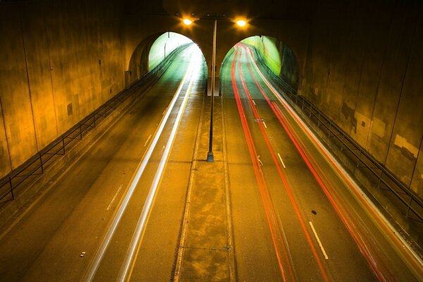 Car tunnel illuminated by lanterns