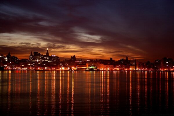 Beautiful night city. Reflection on the water