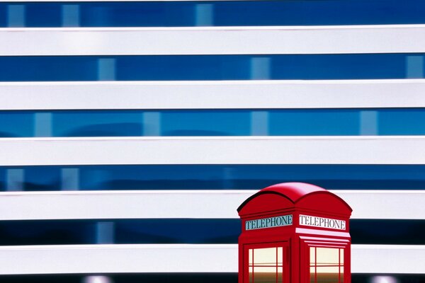 The phone booth is red. Stripe