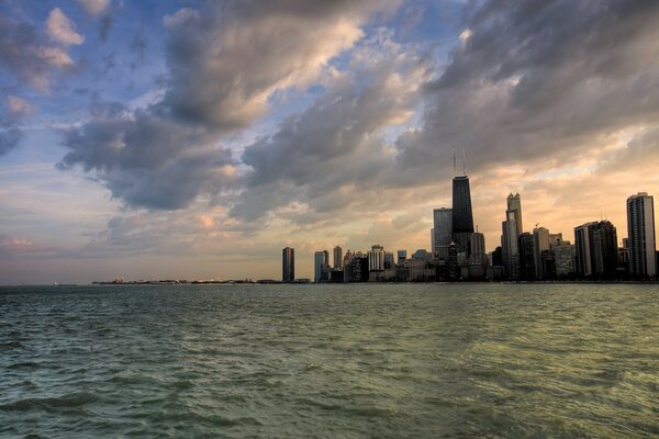 Water. Skyline. Clouds. City