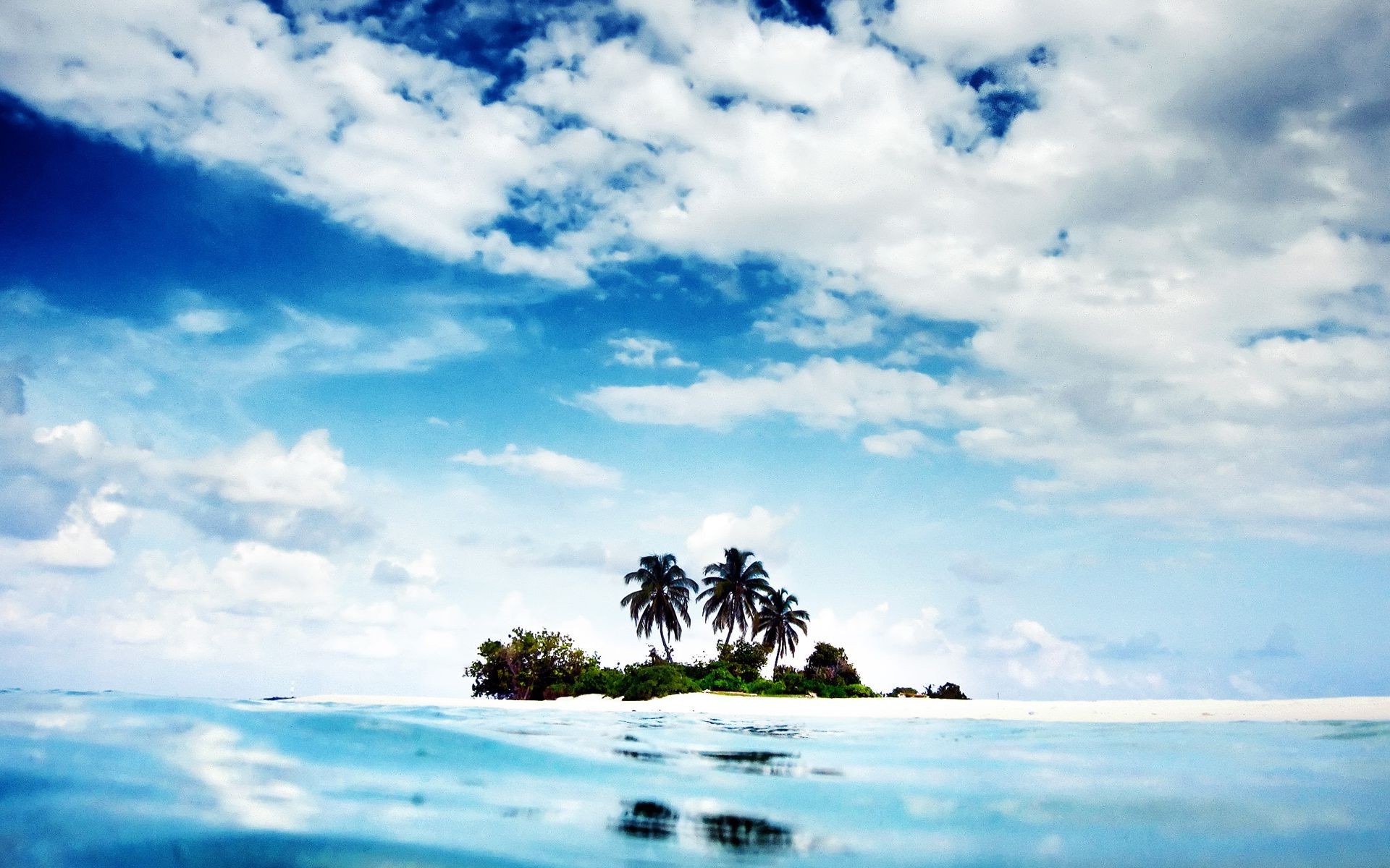 islands beach water ocean summer sky travel tropical seashore nature sea seascape island sun sand outdoors landscape fair weather cloud scenic