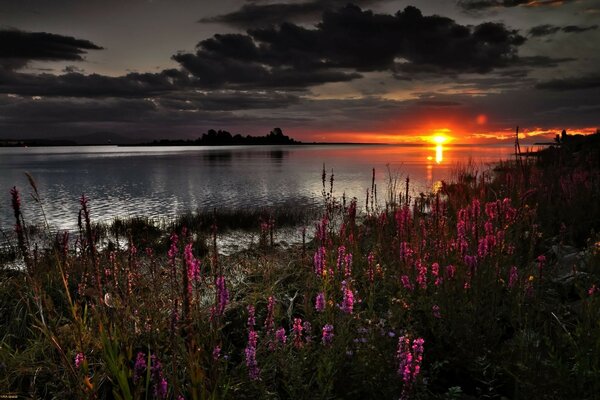 Sunset is like a bonfire flame on the water