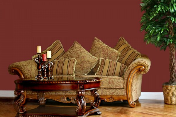 Vintage furniture, upholstered sofa with carved coffee table