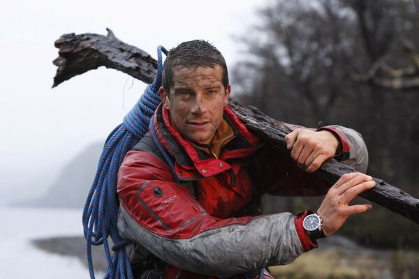 Portrait of a man carrying a log