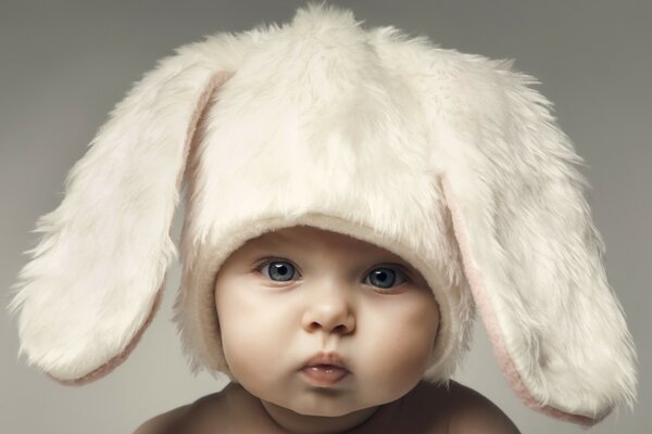 A child in a cute fur hat