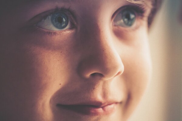 Portrait of a child with angelic eyes in the morning