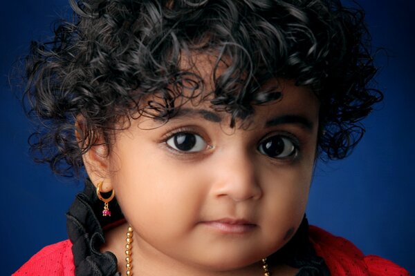 A little girl with curly hair