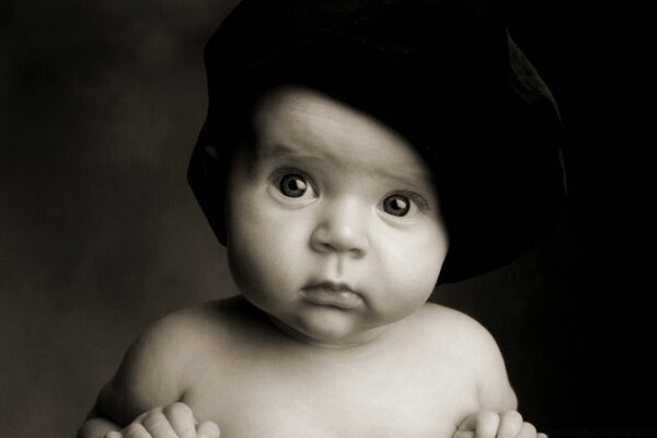 Portrait of a child in a black hat