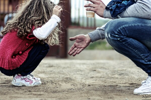 Adult and child playing outside