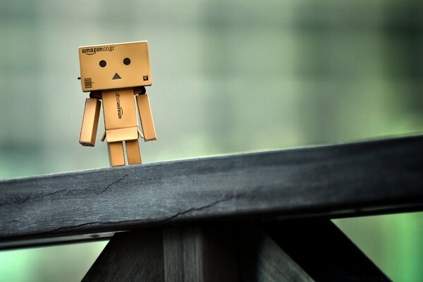 A cardboard man stands on the bridge