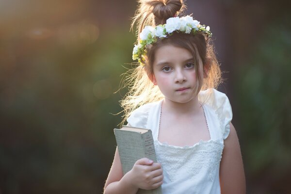 Beautiful girl with a wreath on her head