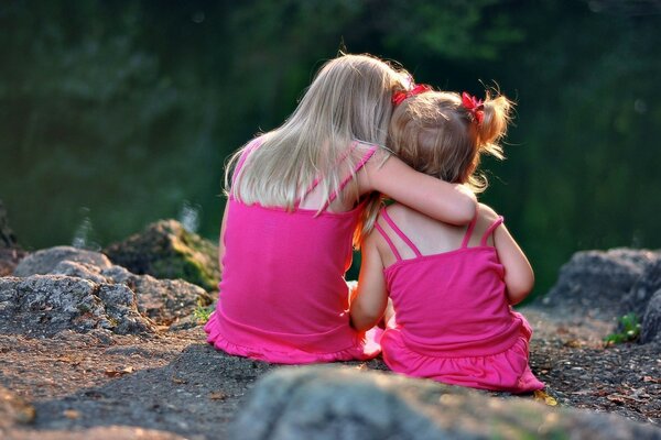 Children hugged and kept secret against the background of nature