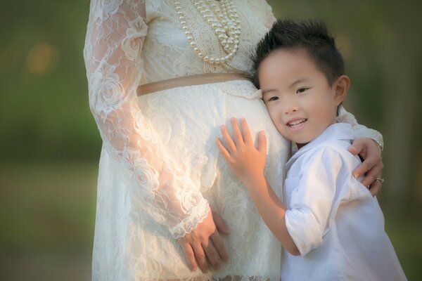 Wedding of a pregnant woman with a child