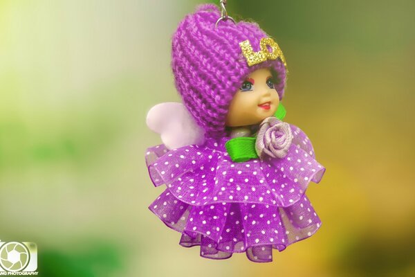 Pequeña muñeca en tonos lila