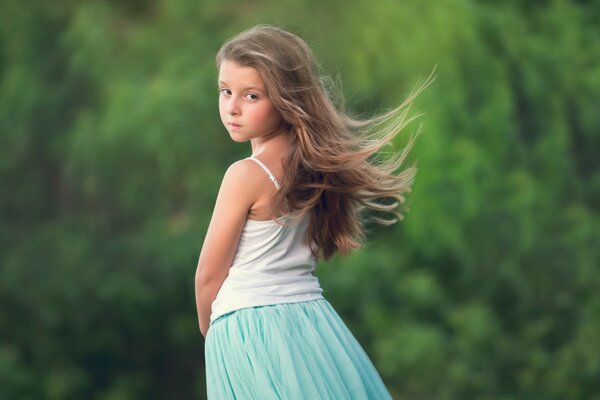 A little girl with loose hair