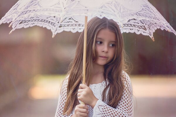 A girl with an umbrella on a summer day