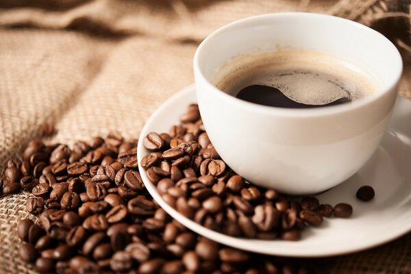 White coffee mug on a white saucer