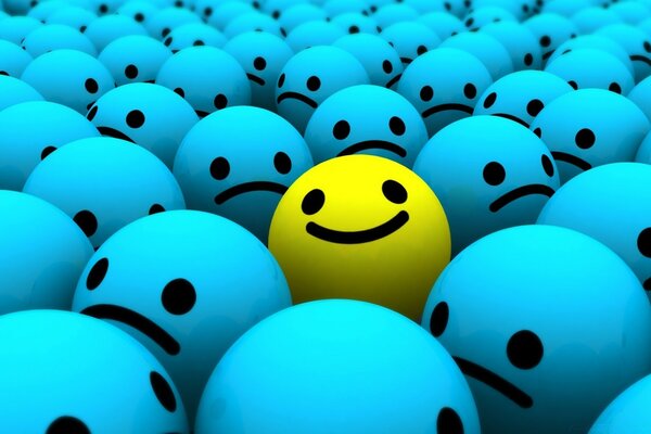 Yellow smiley face among many blue emoticons