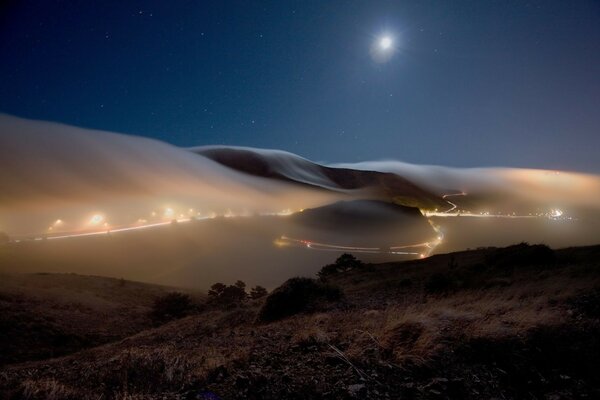 Night landscape. Moon. Lanterns. Sandy Mountains