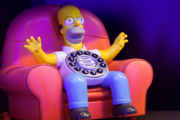 Number simpson is sitting on the couch in the form of a phone