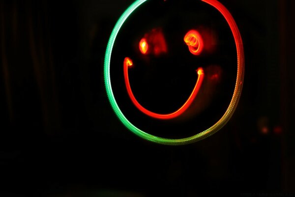 Colorful funny smiley face on a black background
