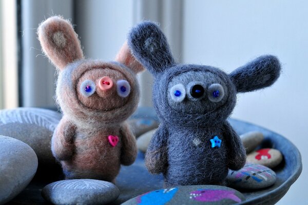 Two funny knitted pigs