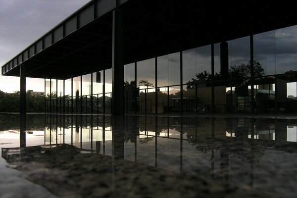 The evening is reflected in the glass of the building