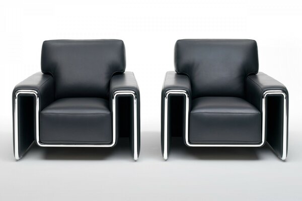 Two black leather chairs