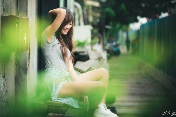 Beautiful girl sitting on the boards