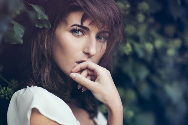 Portrait of a girl against the background of nature