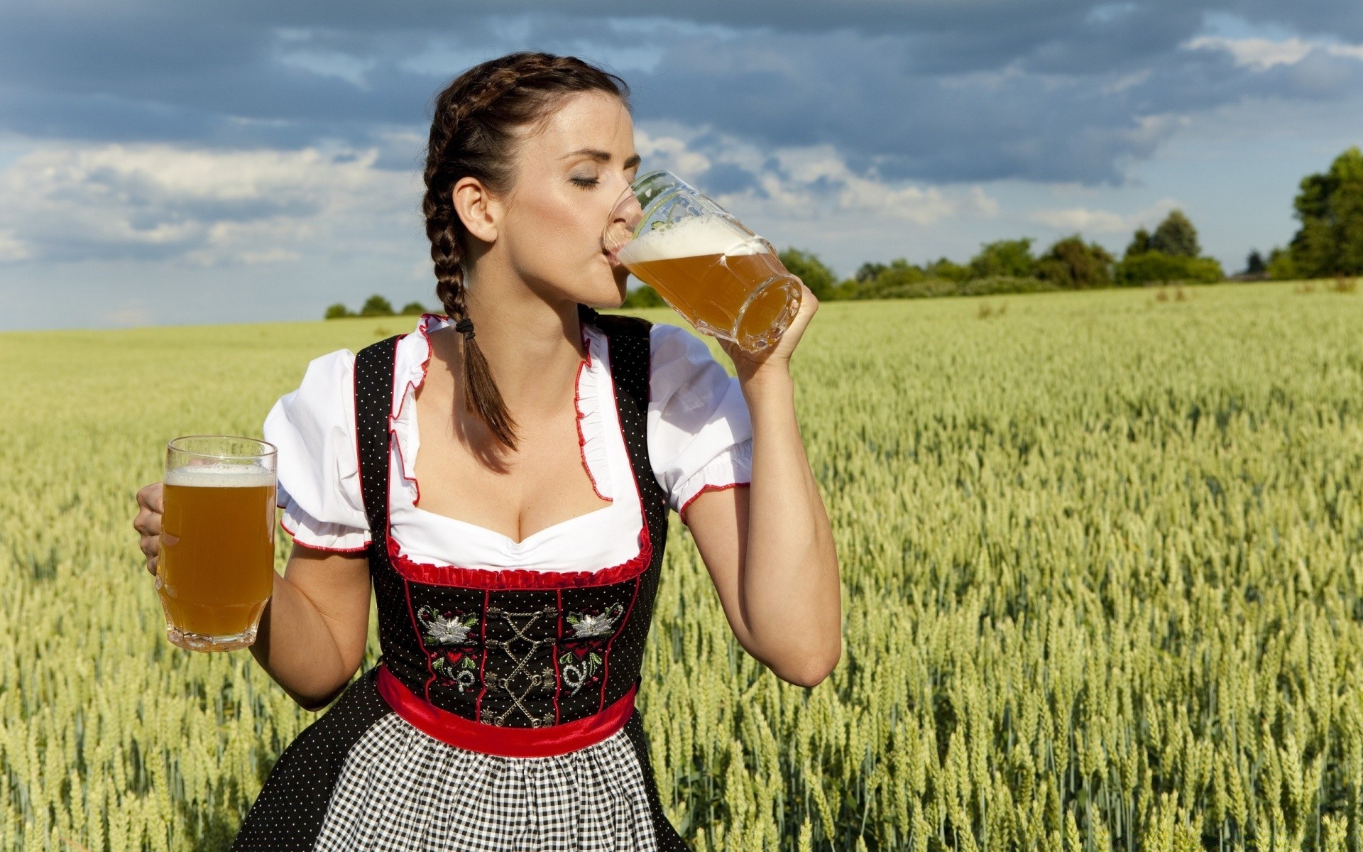 the other girls dirndl summer outdoors nature beer woman enjoyment field fun leisure girl dress wheat grass countryside happiness lifestyle outside hayfield drink