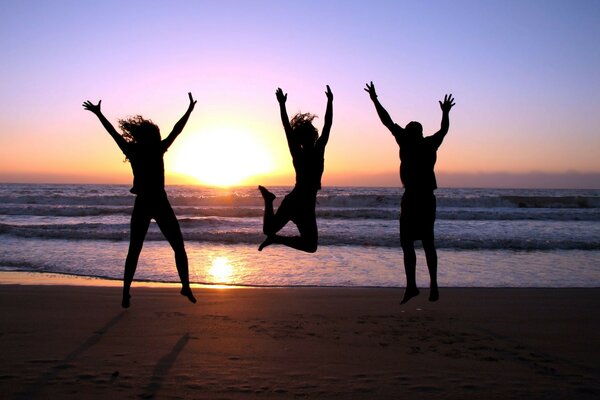 People jump at sunset