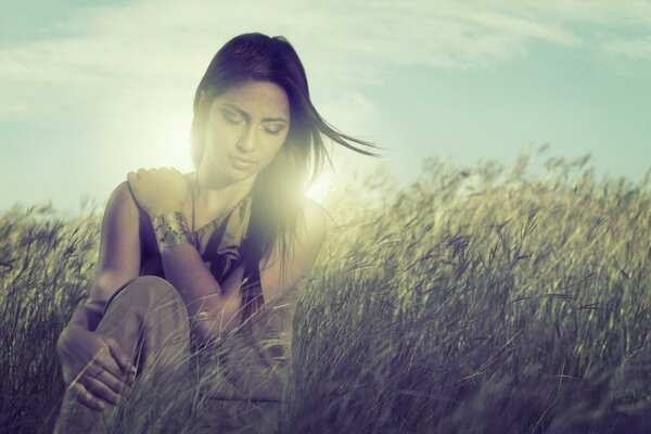 Portrait of a girl in nature at sunset