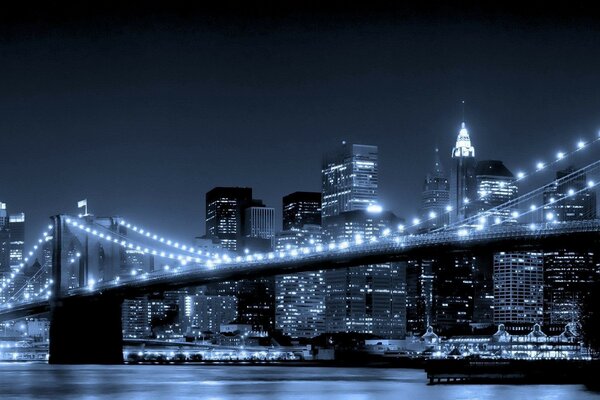 A bridge over the river hung with lights