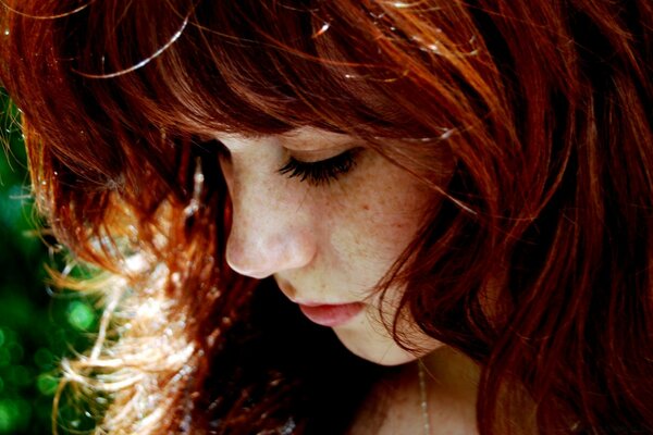 Beautiful redhead girl with freckles