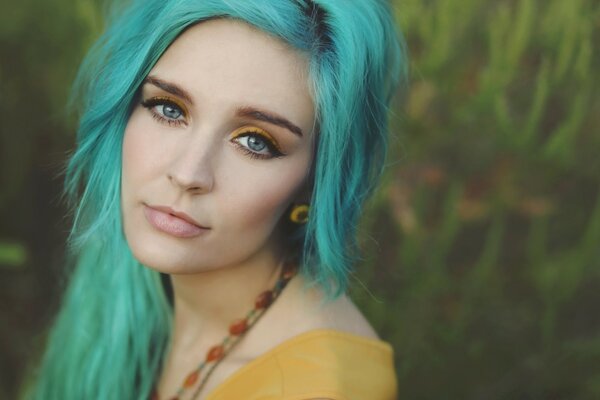 Sad woman with turquoise hair