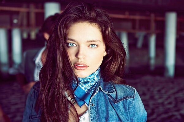 Blue-eyed girl with a cowboy bandage around her neck