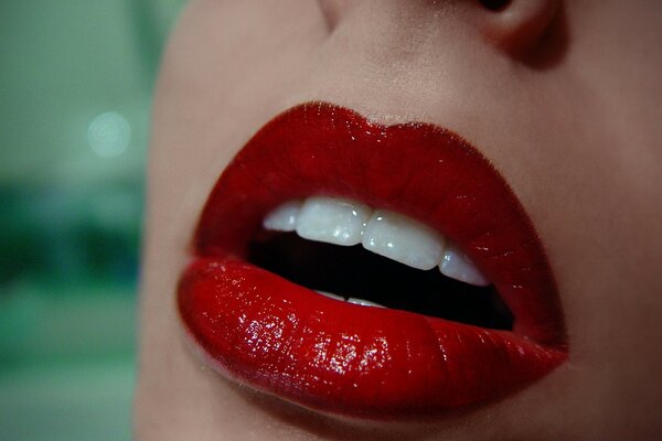 Red lipstick on a woman s lips