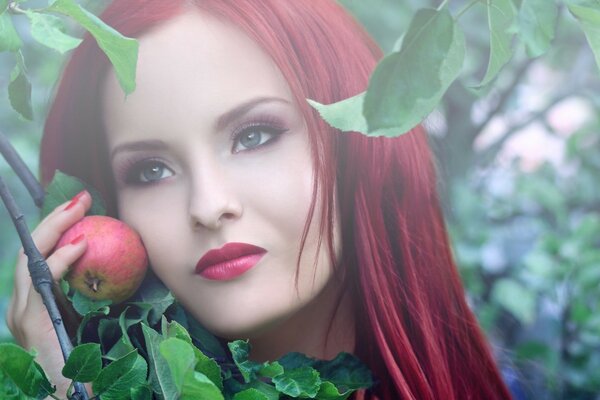 A young girl with an apple in her hands