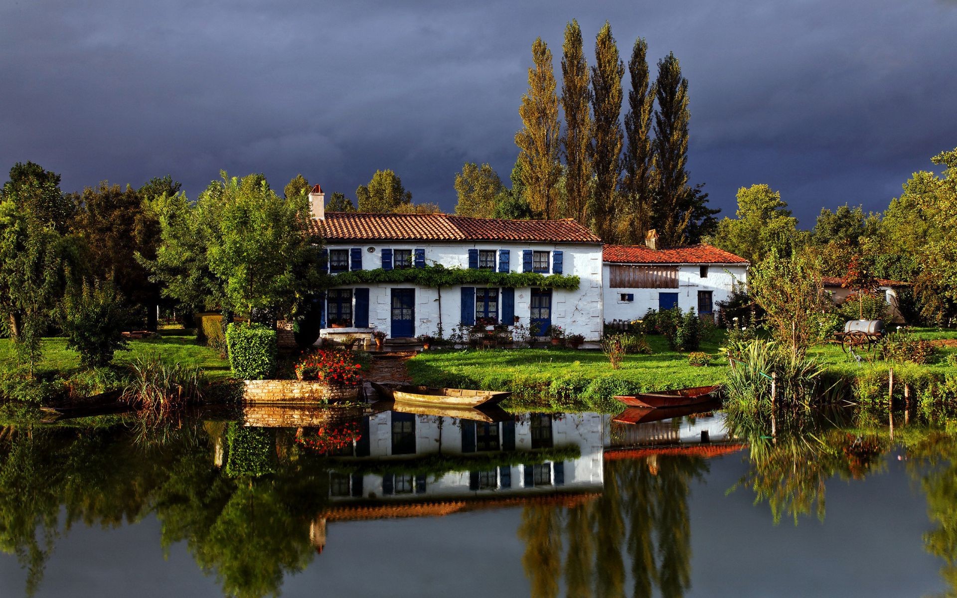 houses and cottages water house lake home architecture outdoors building travel reflection tree pool river traditional wood sky daylight family