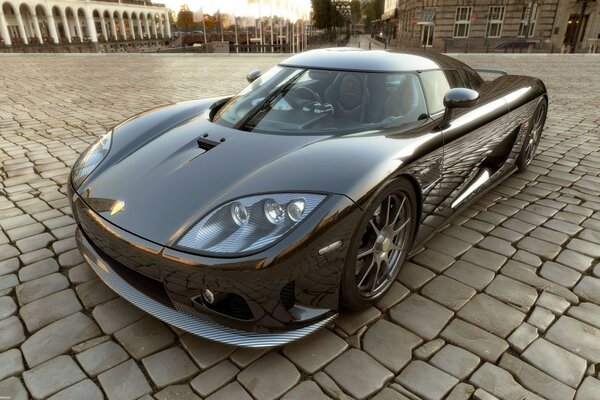 Sports car on a cobblestone road