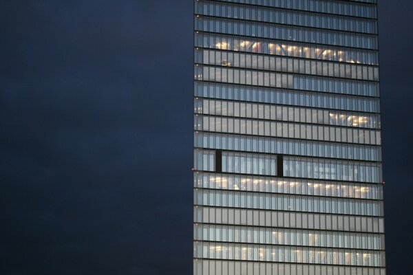 Illuminated skyscraper on the background of the night sky