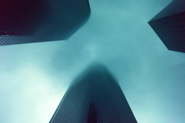 Multi-storey futuristic buildings in the fog
