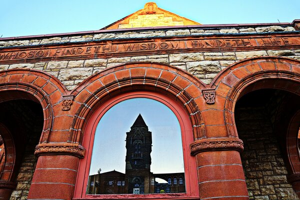 An old colonnade and a church in the background