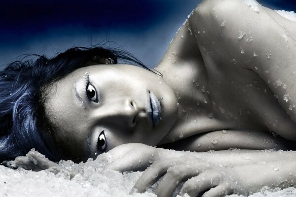 Beautiful girl in nude style in the snow