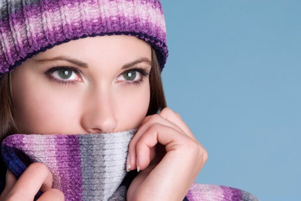 A girl in a scarf and a hat