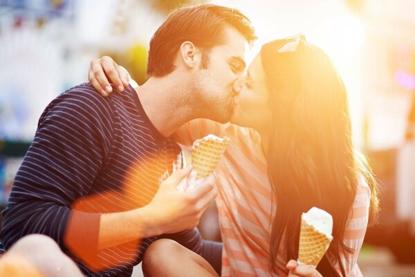 Two people in love with ice cream in their hands