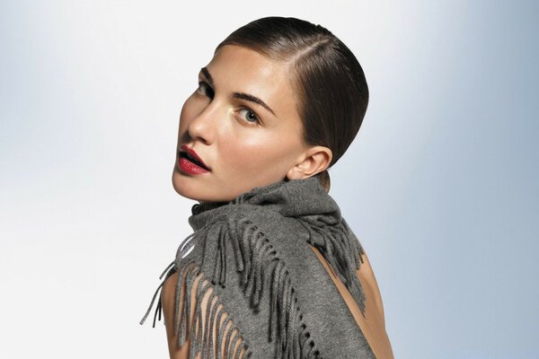 Portrait of a model with a scarf on her shoulders